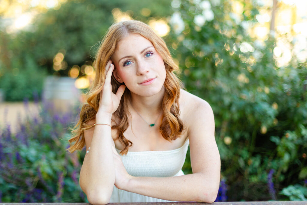 a woman leaning against a railing