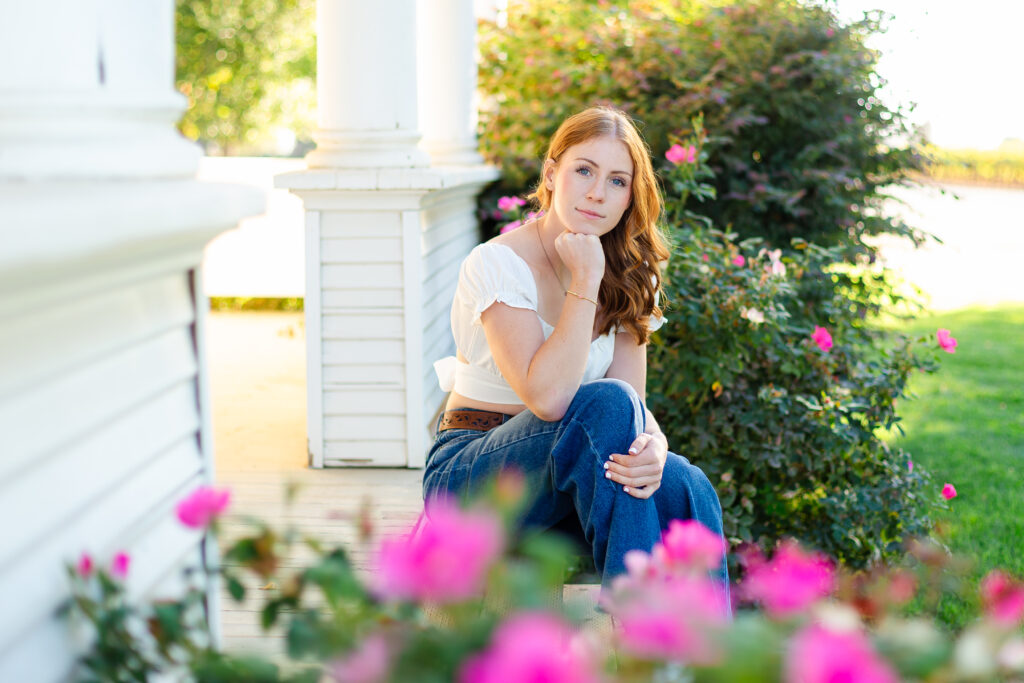 a high school senior sitting on a porch.