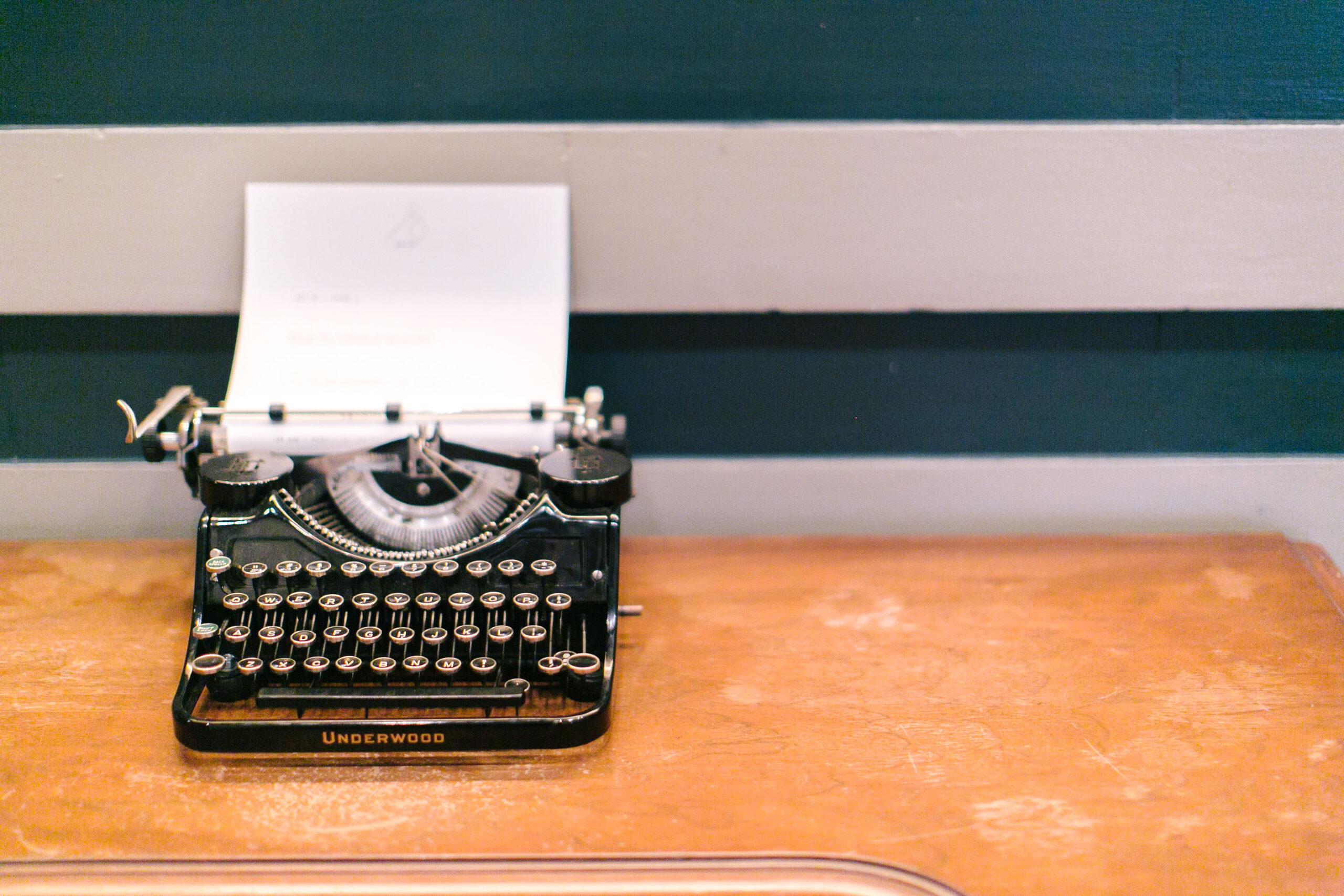 an old fashioned typewriter with a sheet of paper